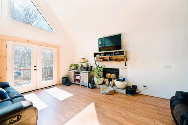 a living room with furniture and a flat screen tv