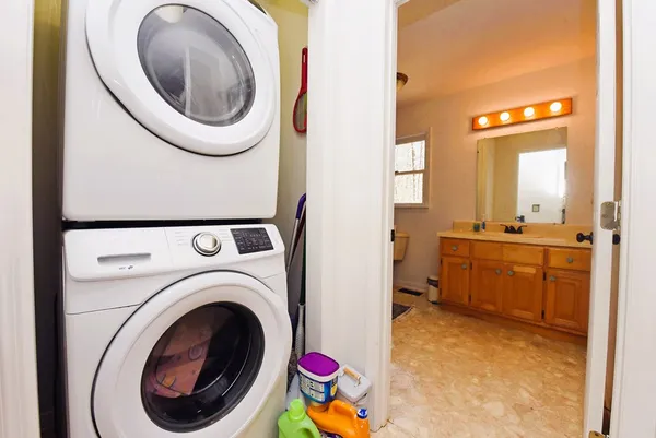 a view of a hallway with washer and dryer