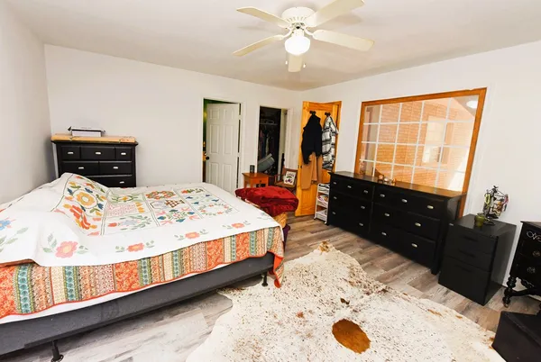 a bathroom with a toilet and a shower curtain
