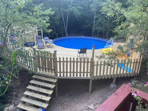 a view of a patio with a table and chairs