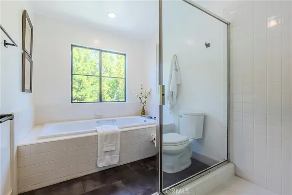 a bathroom with a sink a toilet and a bathtub