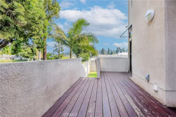 a view of roof deck with potted plants