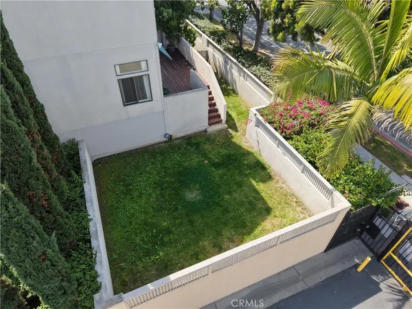 a view of a garden from a balcony