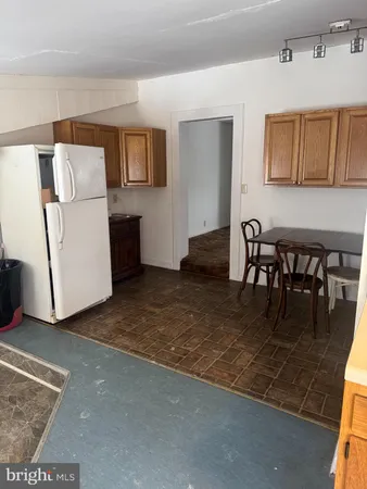 a view of kitchen with furniture and window