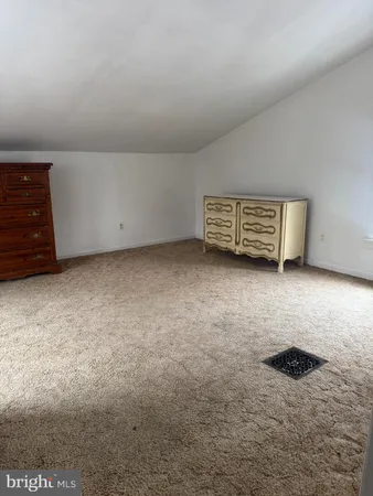a view of an empty room with a stove