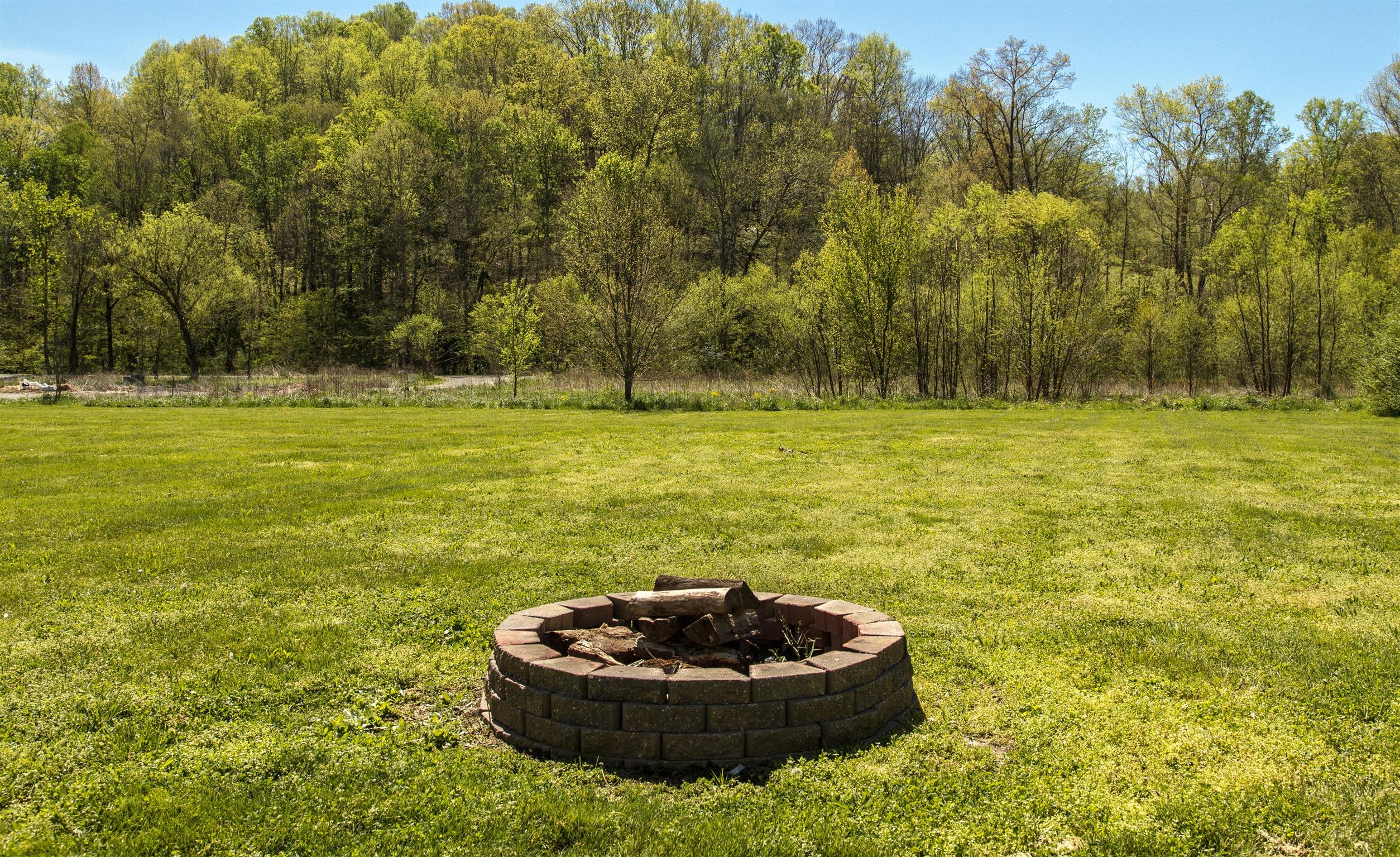 6740 Leipers Creek Road Columbia, TN 38401 - Photo 6 of 26 quiet and open back yard for evening fires.