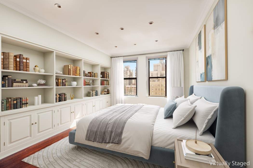 920 5th Avenue, Unit 10B Manhattan, NY 10021 - Photo 11 of 23 a bedroom with a bed furniture and a window