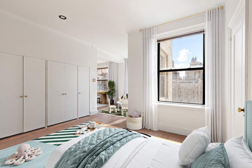 920 5th Avenue, Unit 10B Manhattan, NY 10021 - Photo 20 of 23 a bedroom with a bed and a window