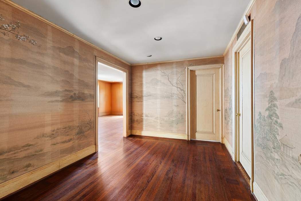 920 5th Avenue, Unit 10B Manhattan, NY 10021 - Photo 3 of 23 a view of hallway with wooden floor