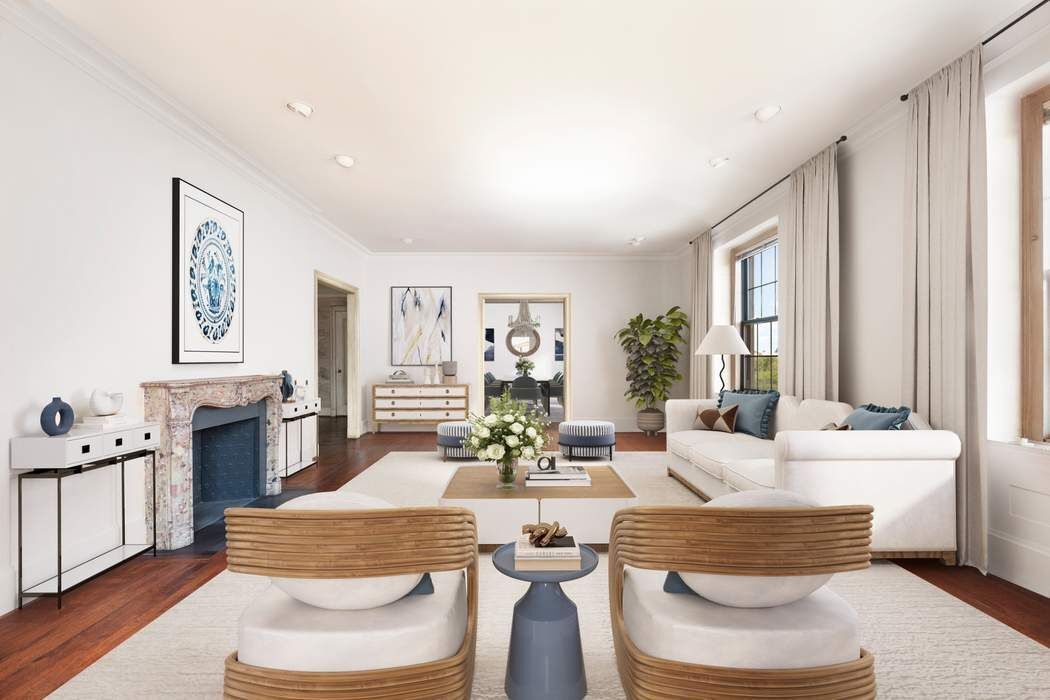 920 5th Avenue, Unit 10B Manhattan, NY 10021 - Photo 4 of 23 a living room with furniture and a fireplace