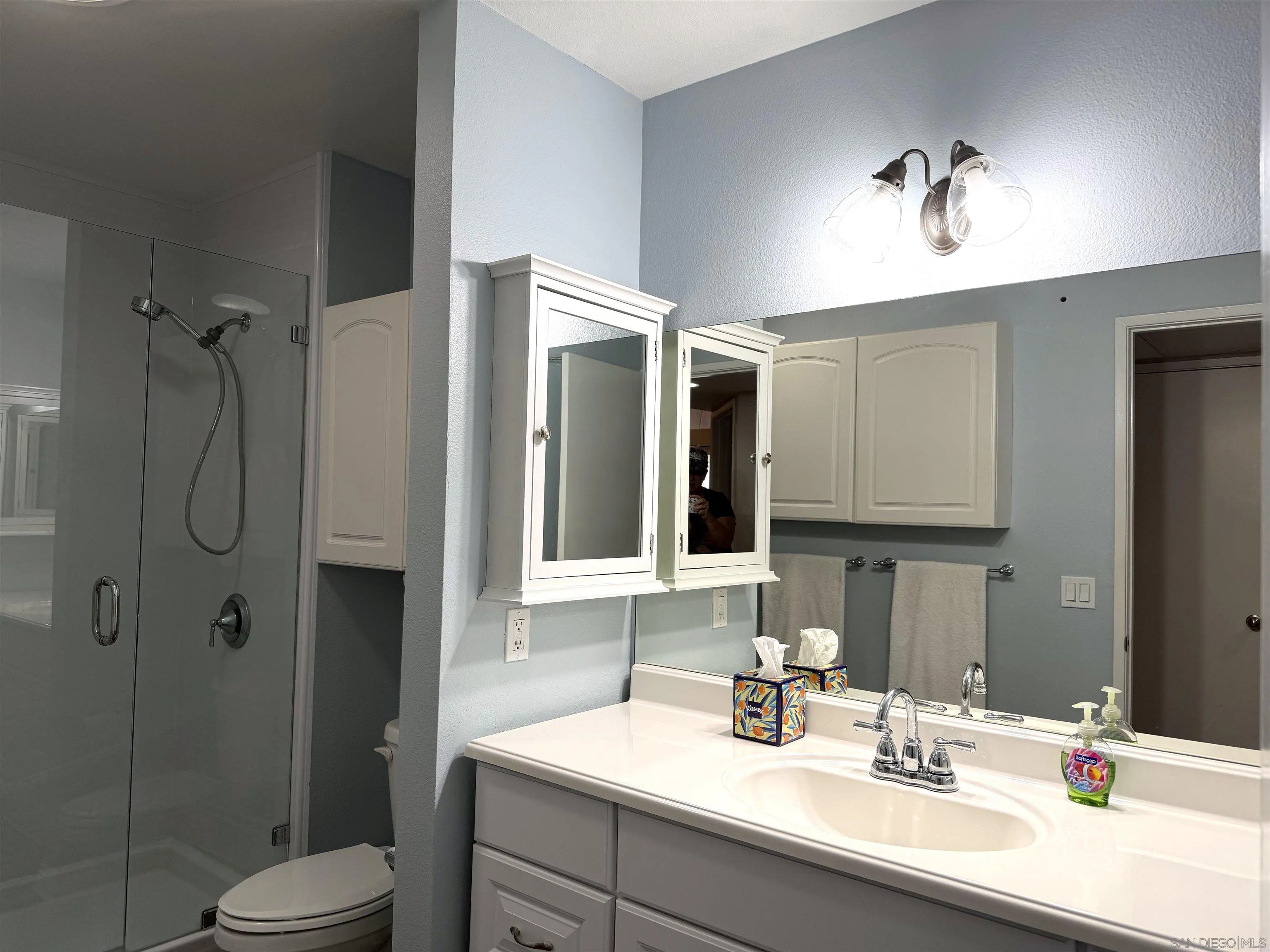 17161 Alva Road, Unit 123 San Diego, CA 92127 - Photo 16 of 30 a bathroom with a sink a toilet and shower