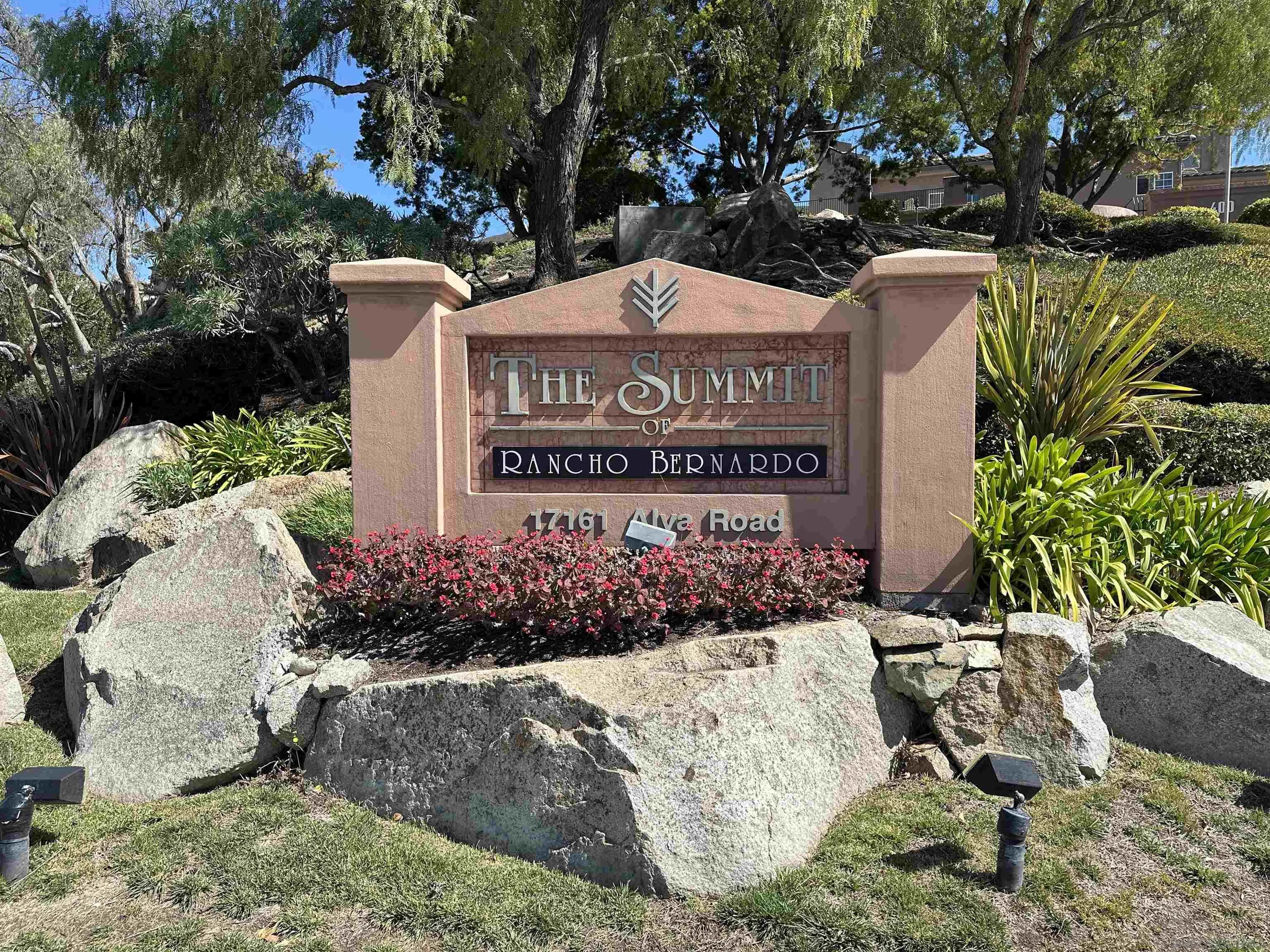 17161 Alva Road, Unit 123 San Diego, CA 92127 - Photo 3 of 30 a view of a sign board with flower plants