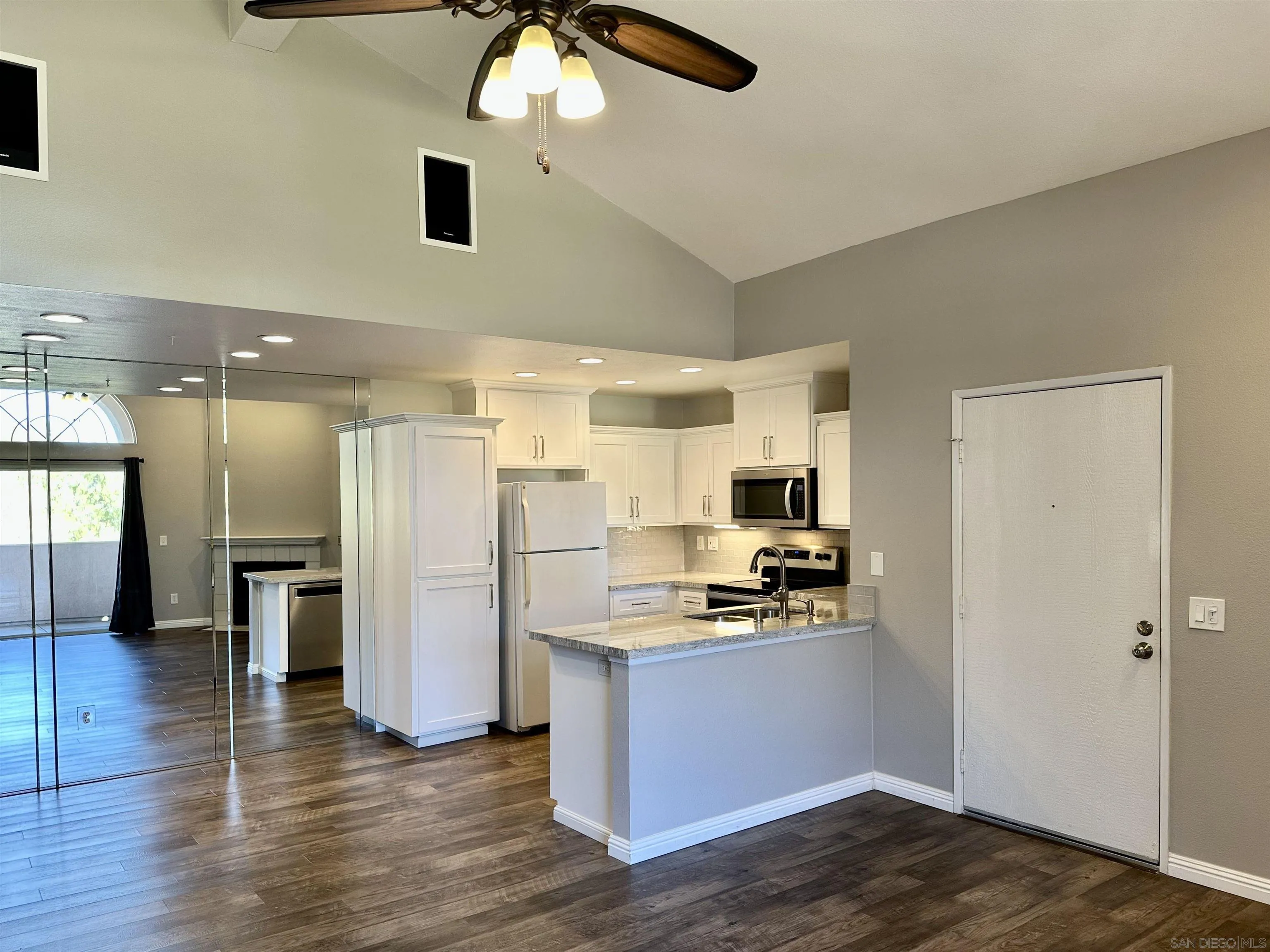 17161 Alva Road, Unit 123 San Diego, CA 92127 - Photo 7 of 30 a kitchen with stainless steel appliances a refrigerator and a stove top oven