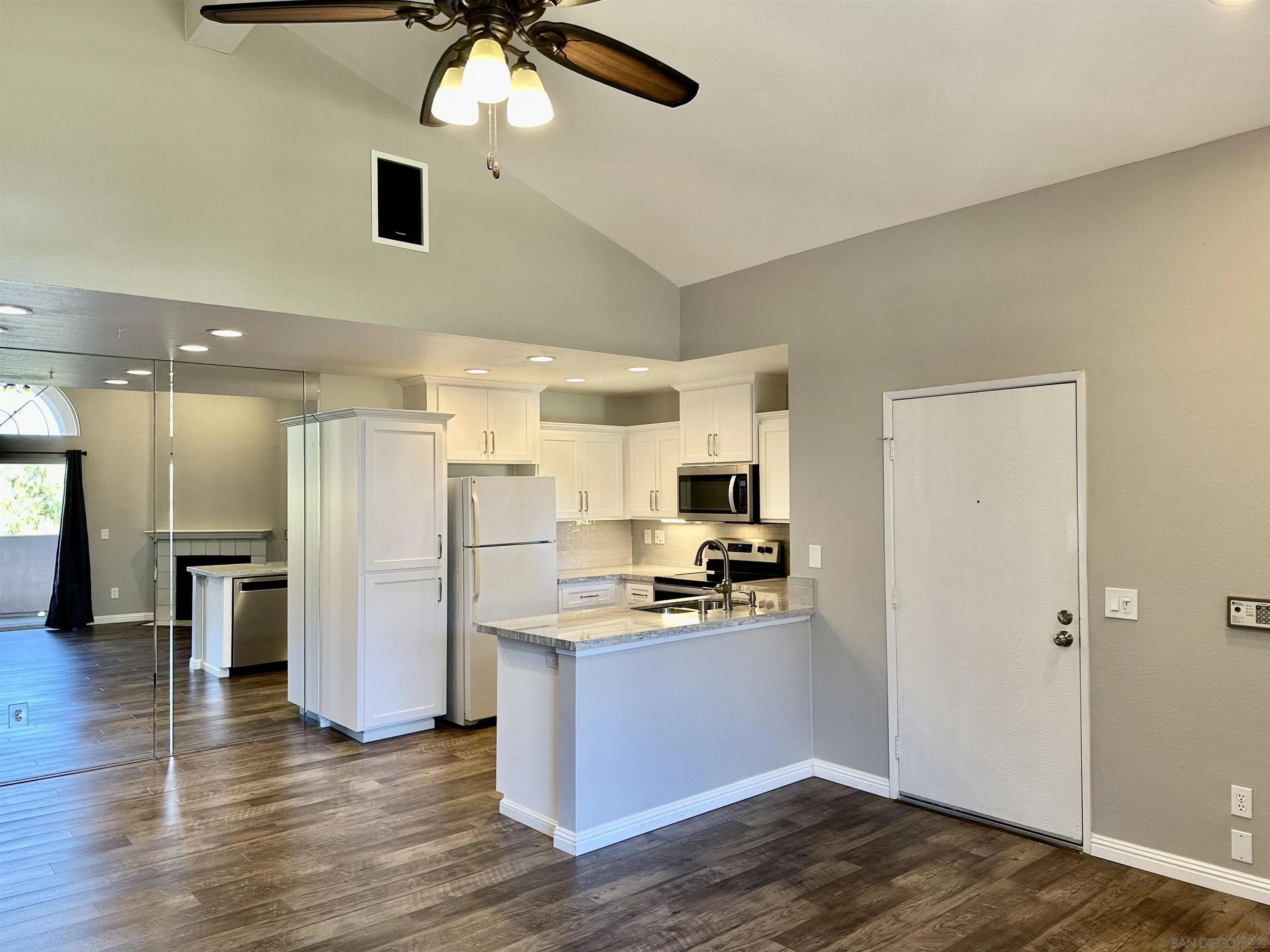 17161 Alva Road, Unit 123 San Diego, CA 92127 - Photo 8 of 30 a kitchen with stainless steel appliances a refrigerator and a stove top oven