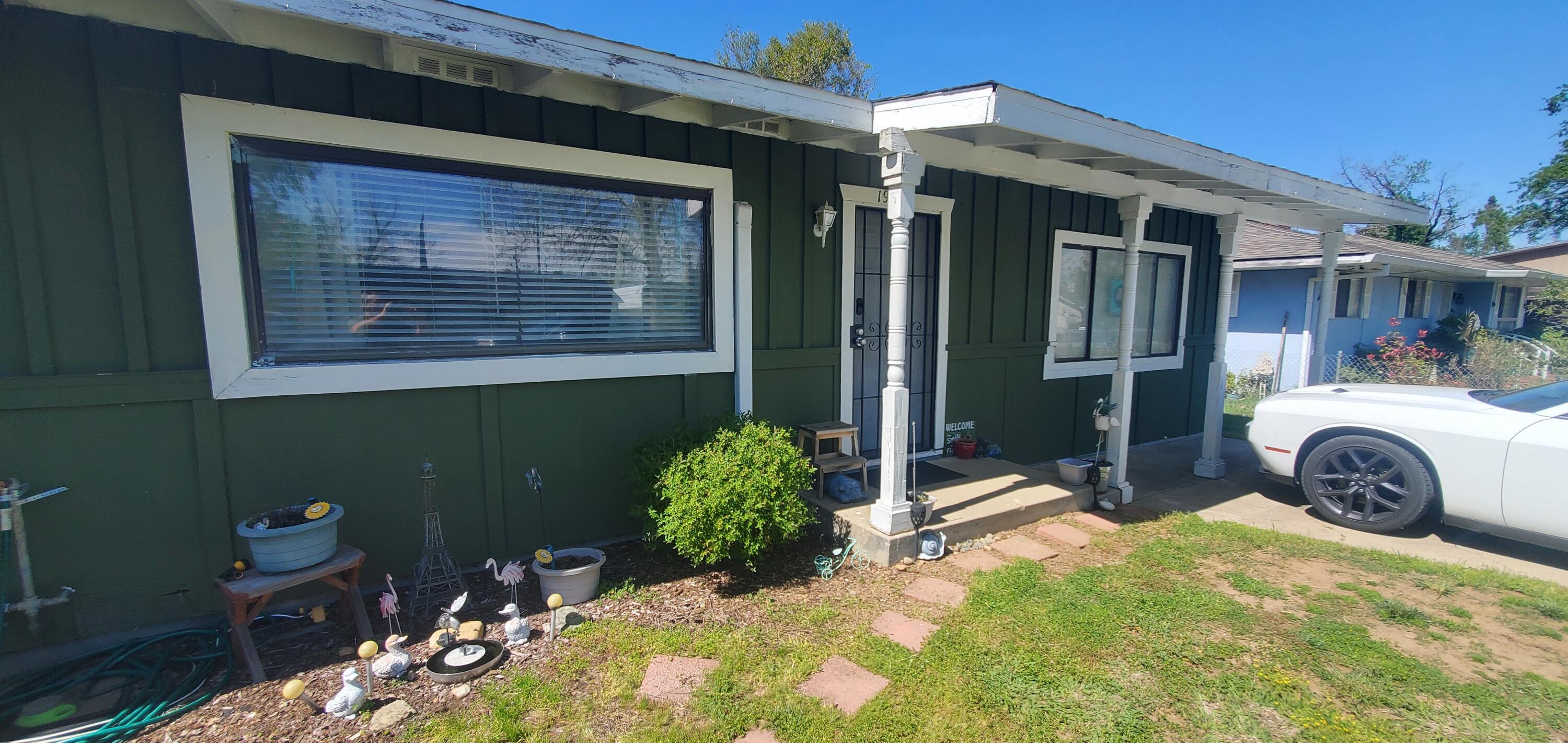 19368 Lucille Street Anderson, CA 96007 - Photo 1 of 13 a front view of a house with a yard