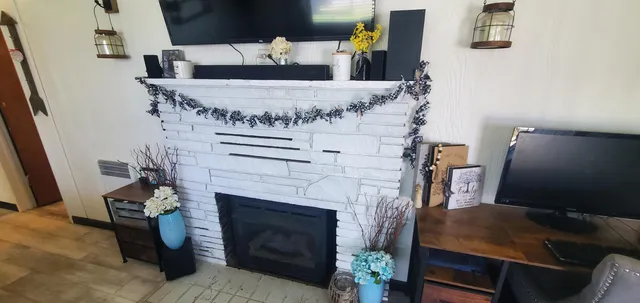 a living room with furniture and a fireplace