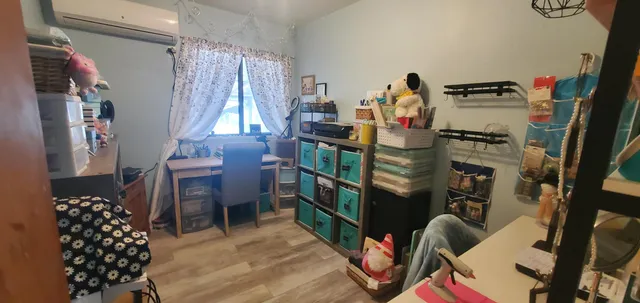 a room with furniture a rug and a window