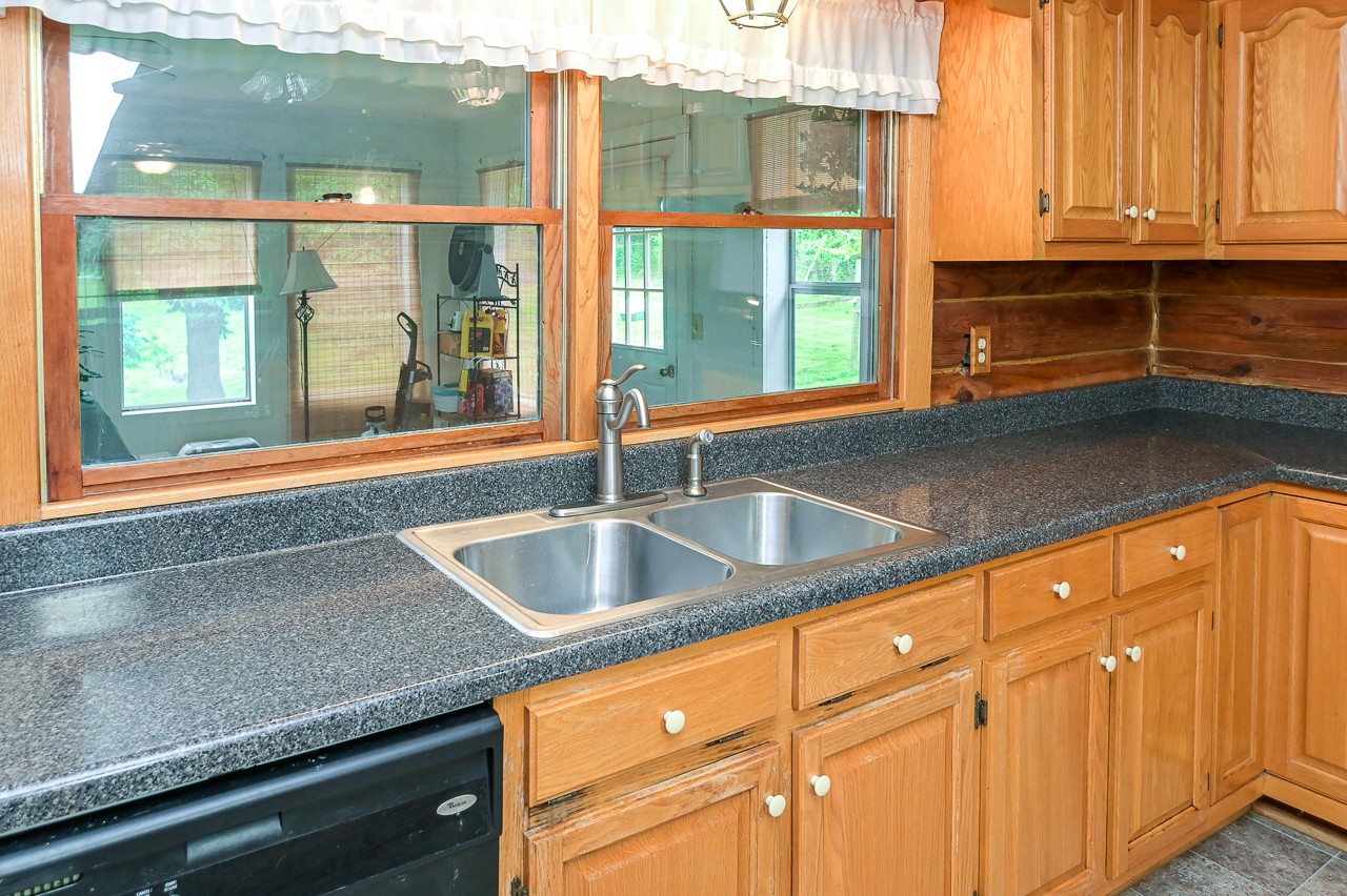 855 Hickory Drive Pulaski, TN 38478 - Photo 13 of 57 a kitchen with granite countertop a sink and a window