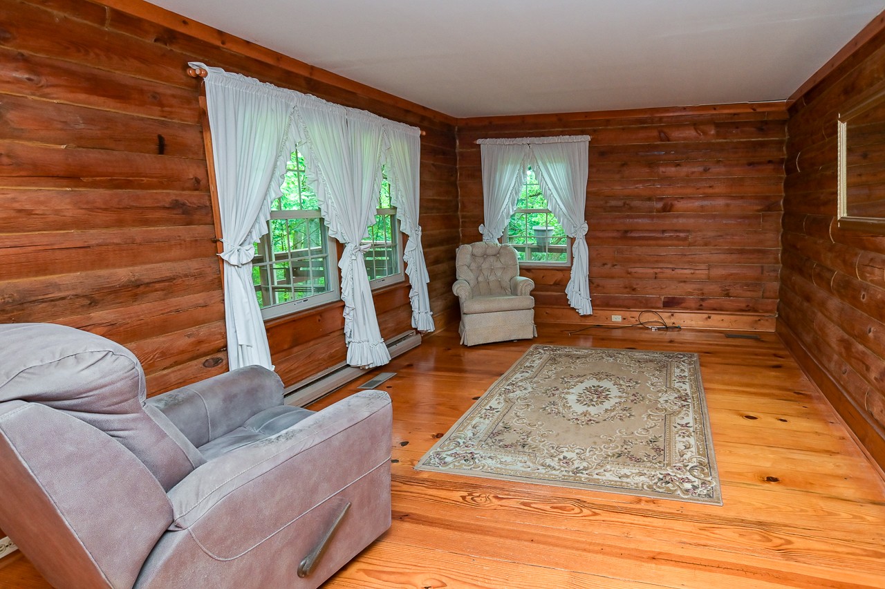855 Hickory Drive Pulaski, TN 38478 - Photo 15 of 57 a living room with furniture floor to ceiling window and wooden floor