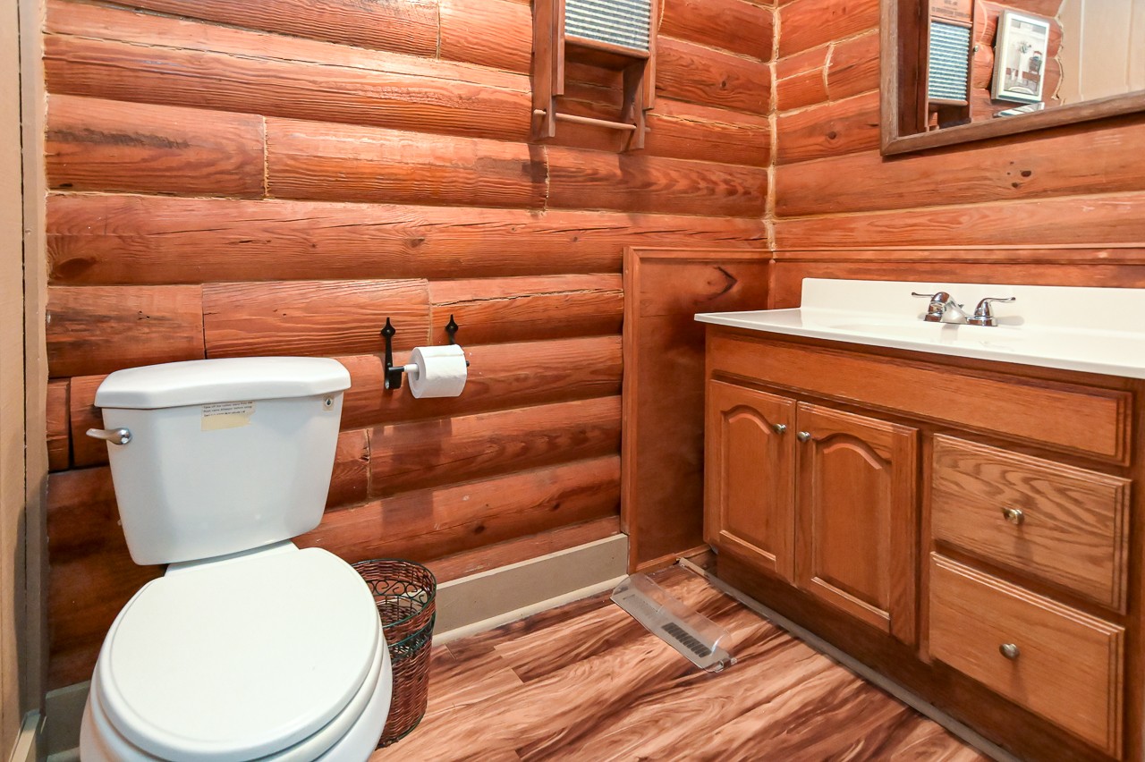 855 Hickory Drive Pulaski, TN 38478 - Photo 19 of 57 a white toilet sitting next to a bathroom sink