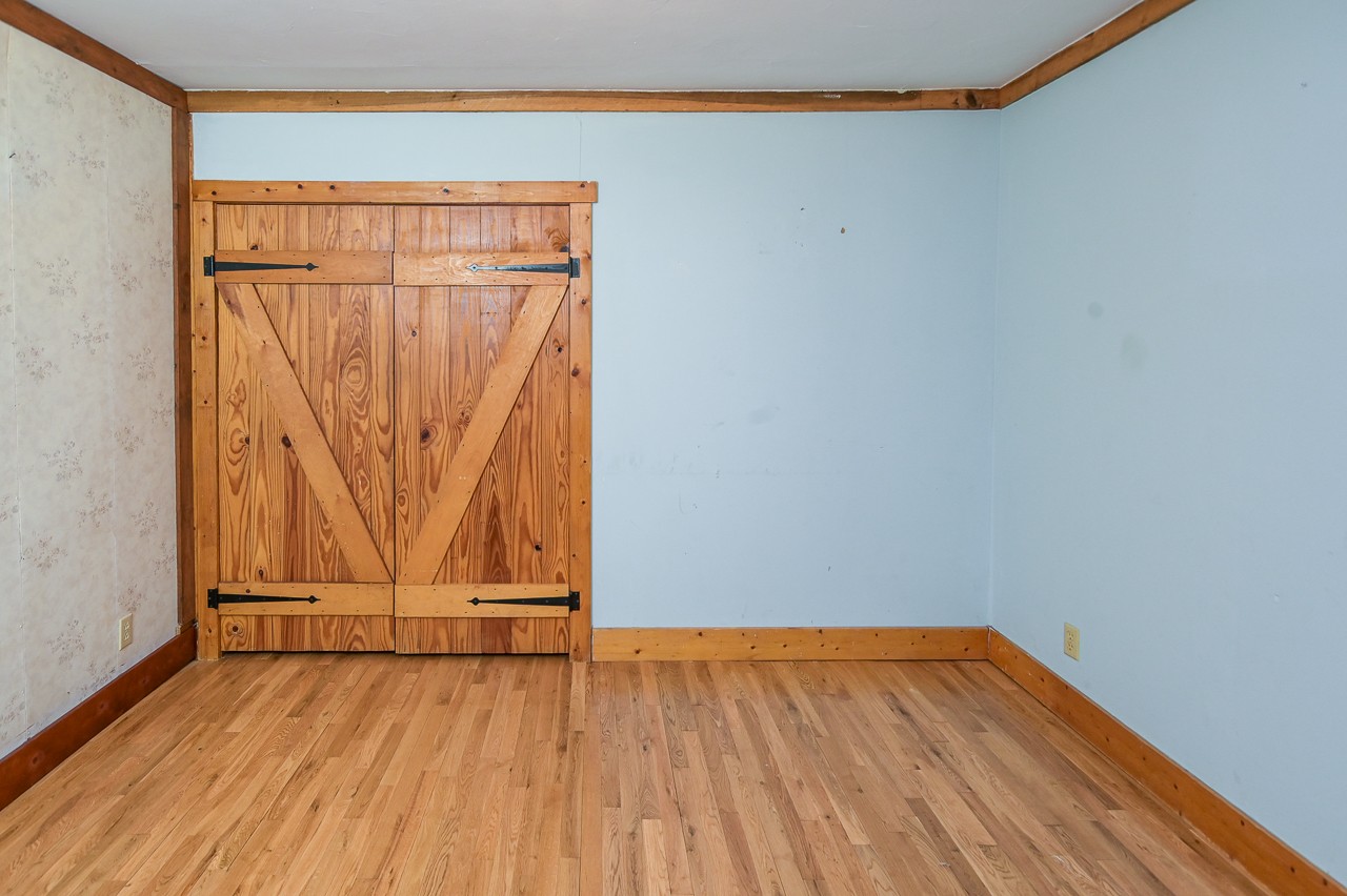 855 Hickory Drive Pulaski, TN 38478 - Photo 20 of 57 a view of a room with wooden floor and white walls