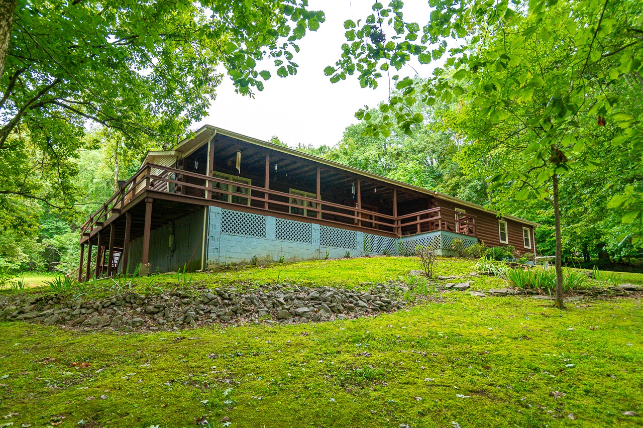 855 Hickory Drive Pulaski, TN 38478 - Photo 3 of 57 a backyard of a house with lots of green space