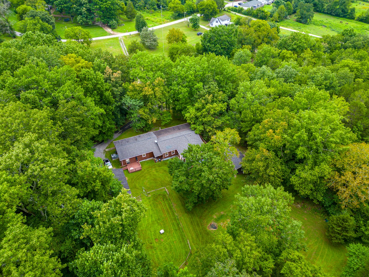 855 Hickory Drive Pulaski, TN 38478 - Photo 49 of 57 an aerial view of residential house with an outdoor space and trees all around