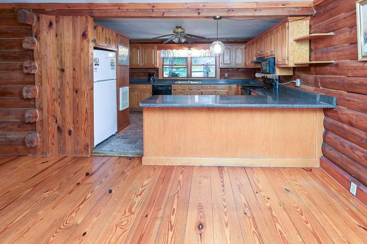 855 Hickory Drive Pulaski, TN 38478 - Photo 9 of 57 a view of kitchen with cabinets and wooden floor
