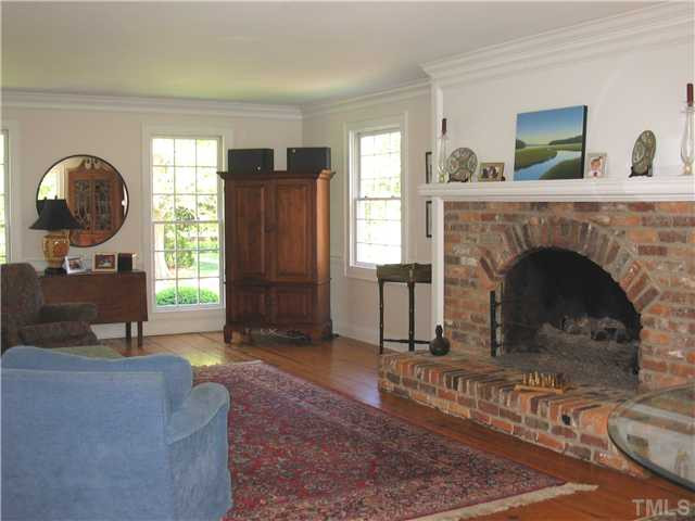 613 Lake Boone Trail Raleigh, NC 27608 - Photo 3 of 18 Brick fireplace in the living room has gas logs. Living Room