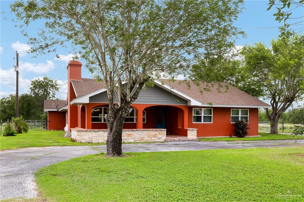 22172 North Olmito Road Rio Hondo, TX 78583 - Photo 4 of 33 a front view of house with yard and green space