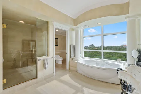 a bathroom with a bathtub and a shower