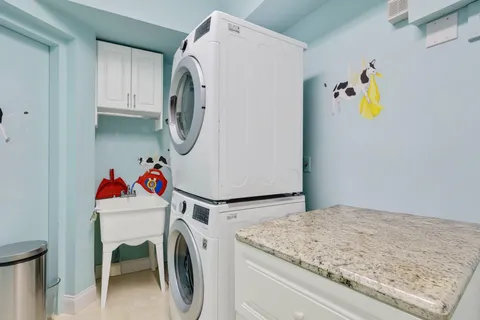 a table and chairs under an umbrella
