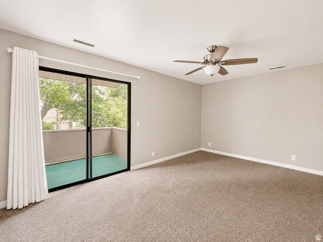 6907 South 745th Street East, Unit G Midvale, UT 84047 - Photo 11 of 30 Large primary suite with separate access to covered balcony