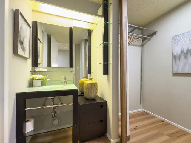 a bathroom with a sink and mirror