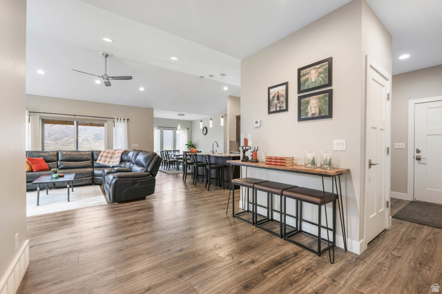 4527 North Seven Bridges Road Eden, UT 84310 - Photo 10 of 65 Living room featuring dark wood-type flooring, a ceiling fan, recessed lighting, and lofted ceiling