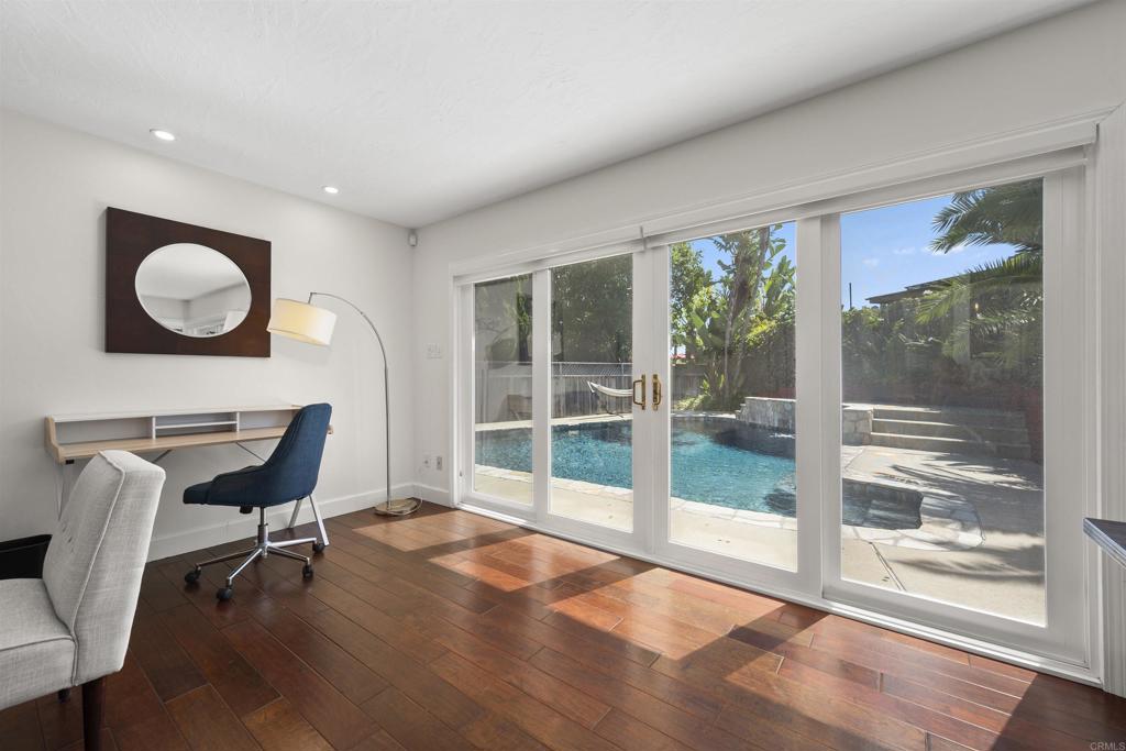3099 Driscoll Drive San Diego, CA 92117 - Photo 13 of 41 a workspace with wooden floor and a window