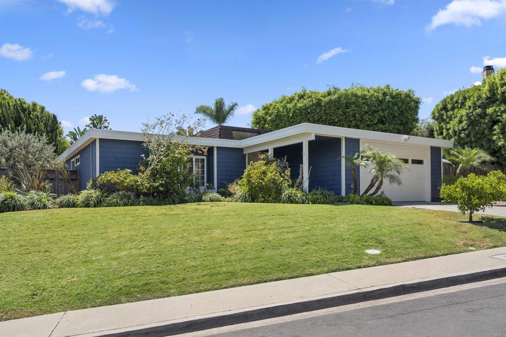 3099 Driscoll Drive San Diego, CA 92117 - Photo 2 of 41 a front view of a house with garden