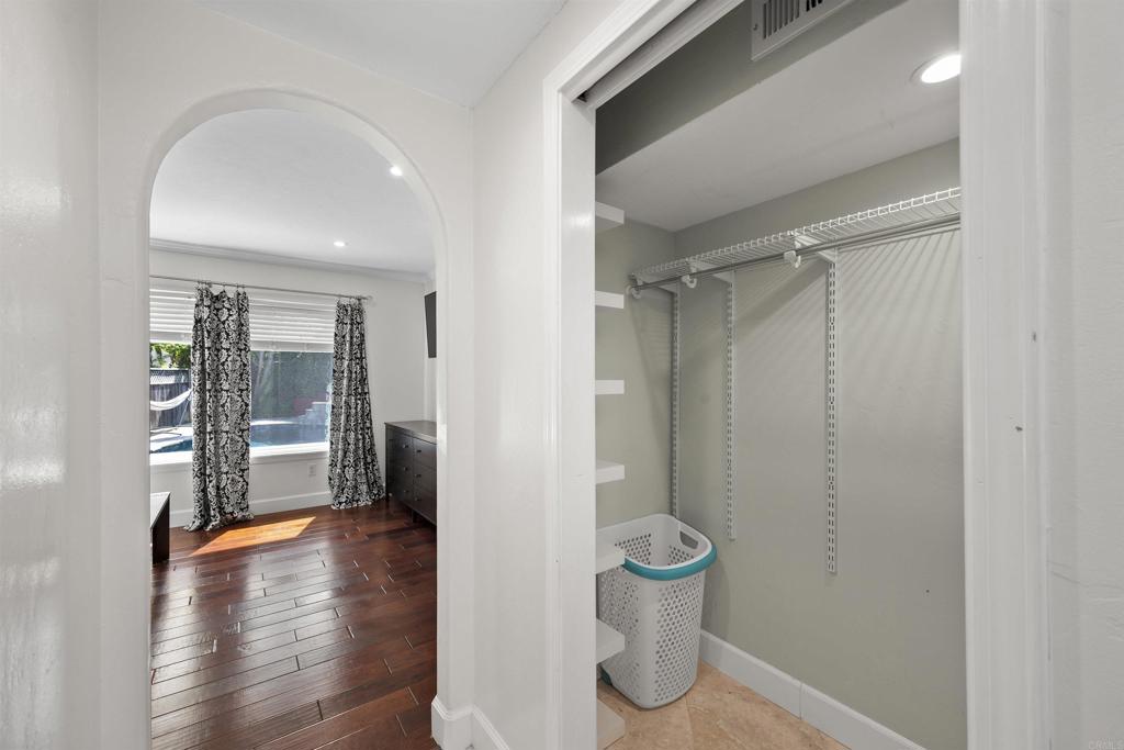3099 Driscoll Drive San Diego, CA 92117 - Photo 28 of 41 a view of entryway with wooden floor and glass door