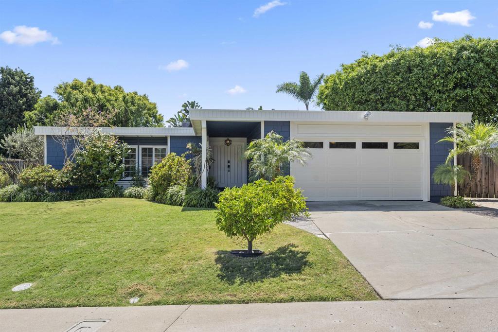 3099 Driscoll Drive San Diego, CA 92117 - Photo 3 of 41 a front view of a house with garden