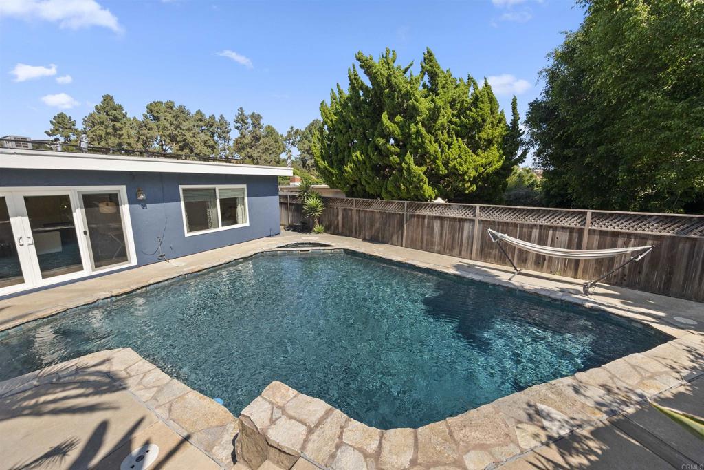 3099 Driscoll Drive San Diego, CA 92117 - Photo 35 of 41 a view of a house with a backyard