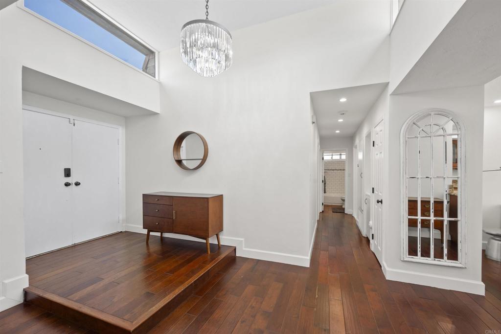 3099 Driscoll Drive San Diego, CA 92117 - Photo 6 of 41 a view of a room with wooden floor and workspace