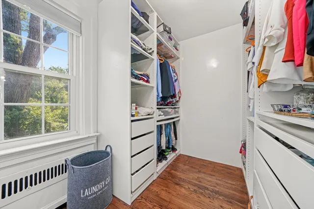 a kitchen with a refrigerator and a stove top oven