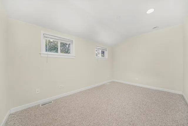 an empty room with a empty space and window