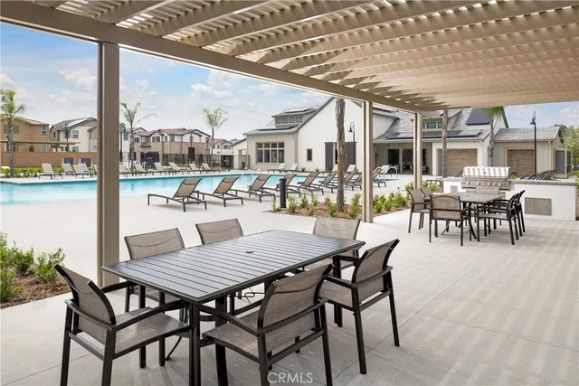 a view of a patio with a table and chairs