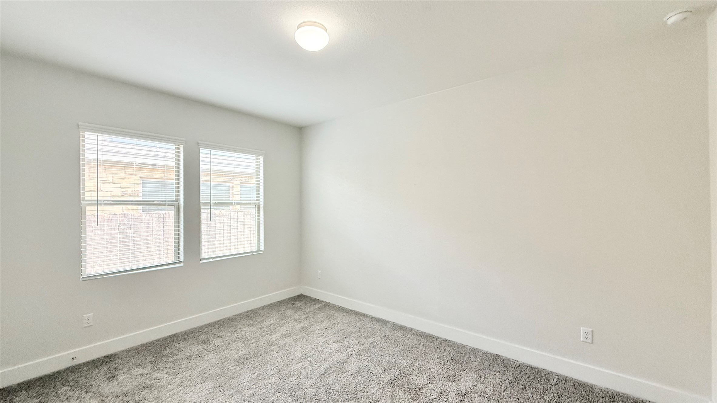 600 Golden Glory Road Leander, TX 78641 - Photo 9 of 21 Spare room featuring baseboards and light colored carpet