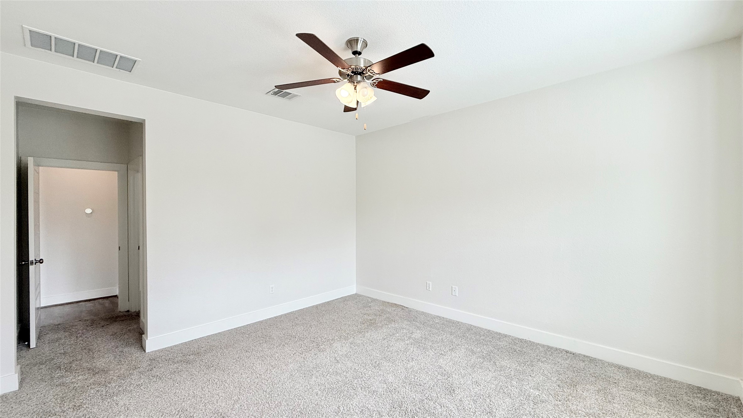 600 Golden Glory Road Leander, TX 78641 - Photo 11 of 21 Unfurnished room featuring light carpet and ceiling fan