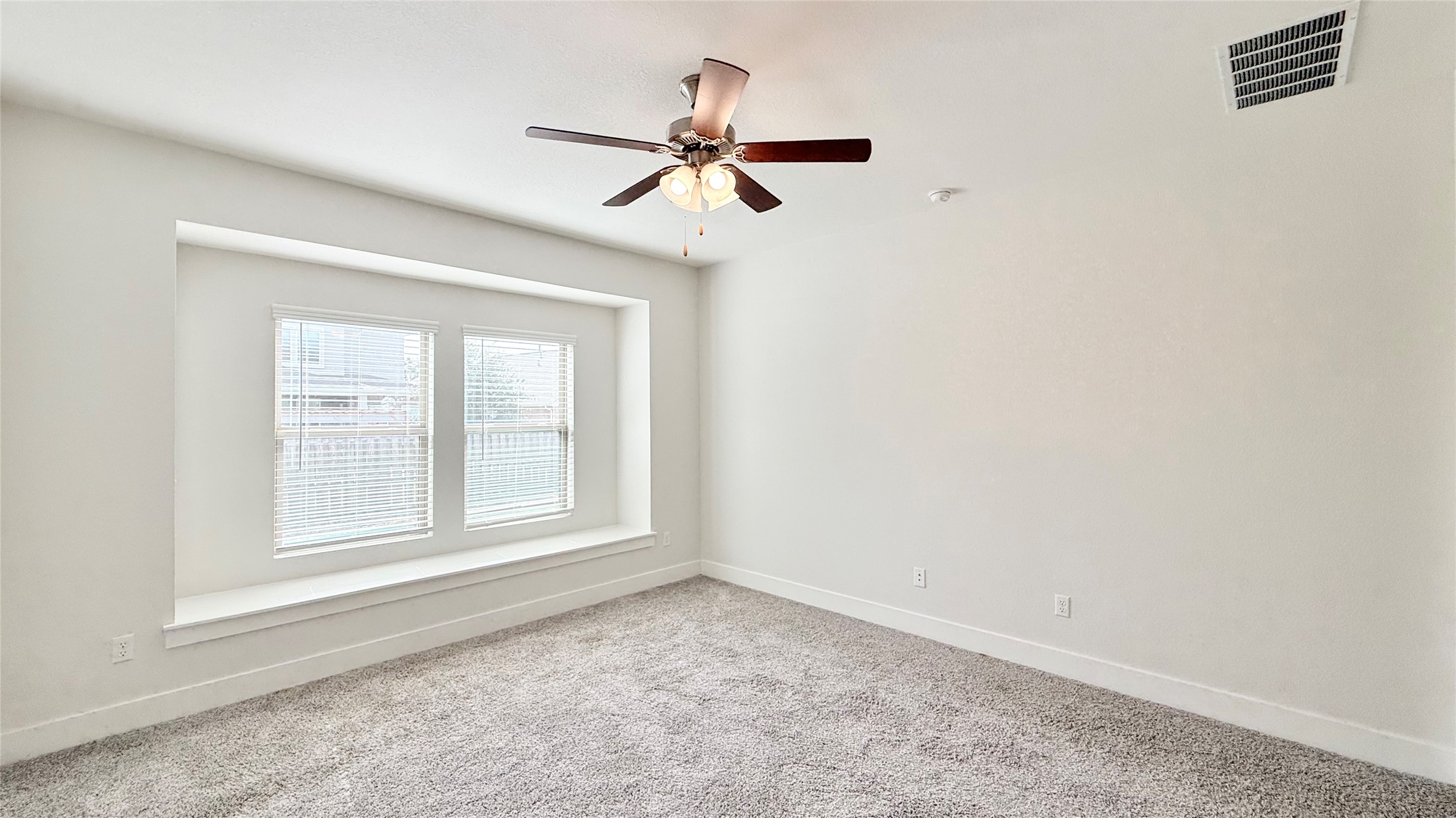 600 Golden Glory Road Leander, TX 78641 - Photo 12 of 21 Unfurnished room featuring light colored carpet and a ceiling fan