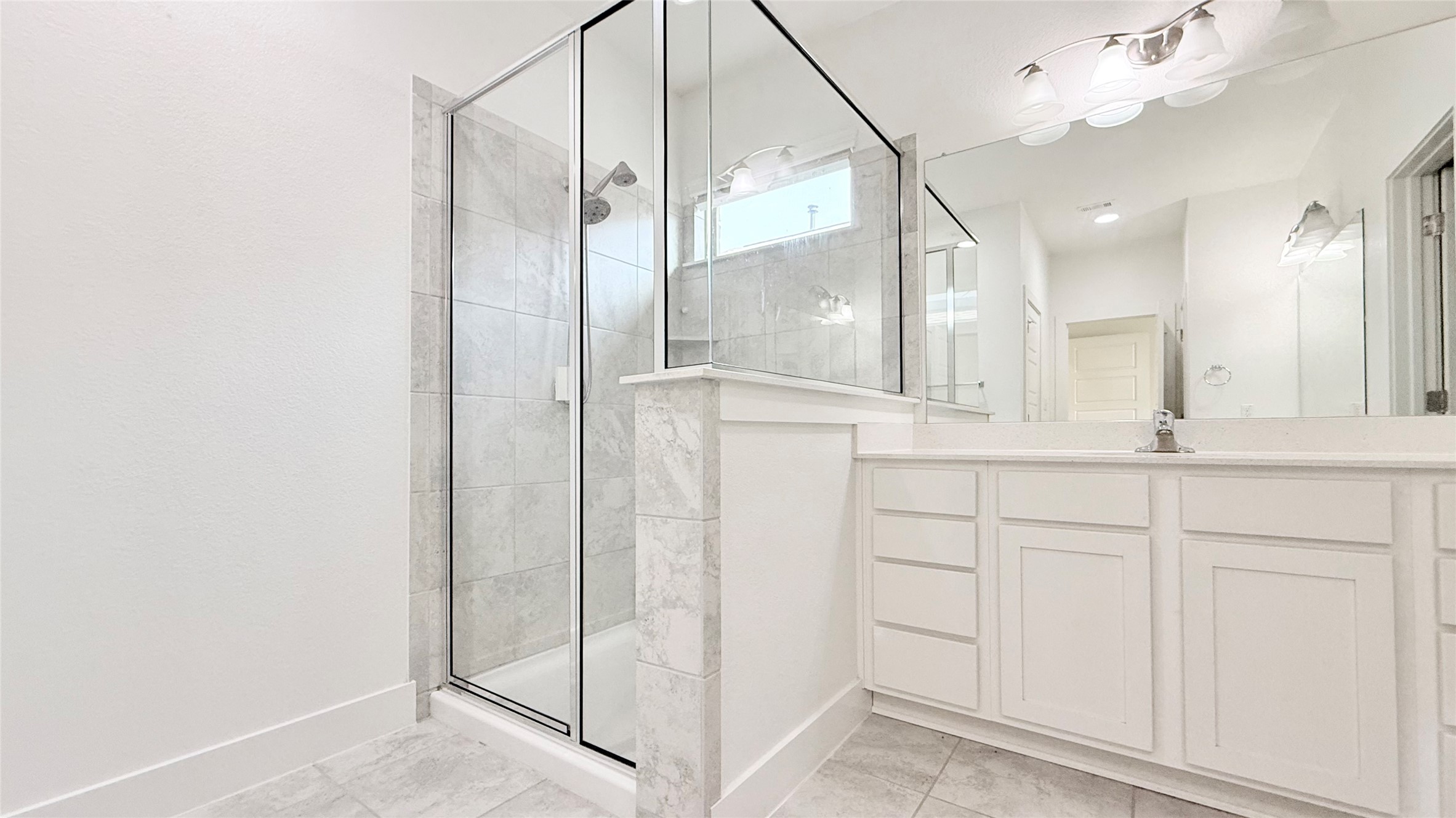 600 Golden Glory Road Leander, TX 78641 - Photo 14 of 21 Bathroom with vanity and a stall shower