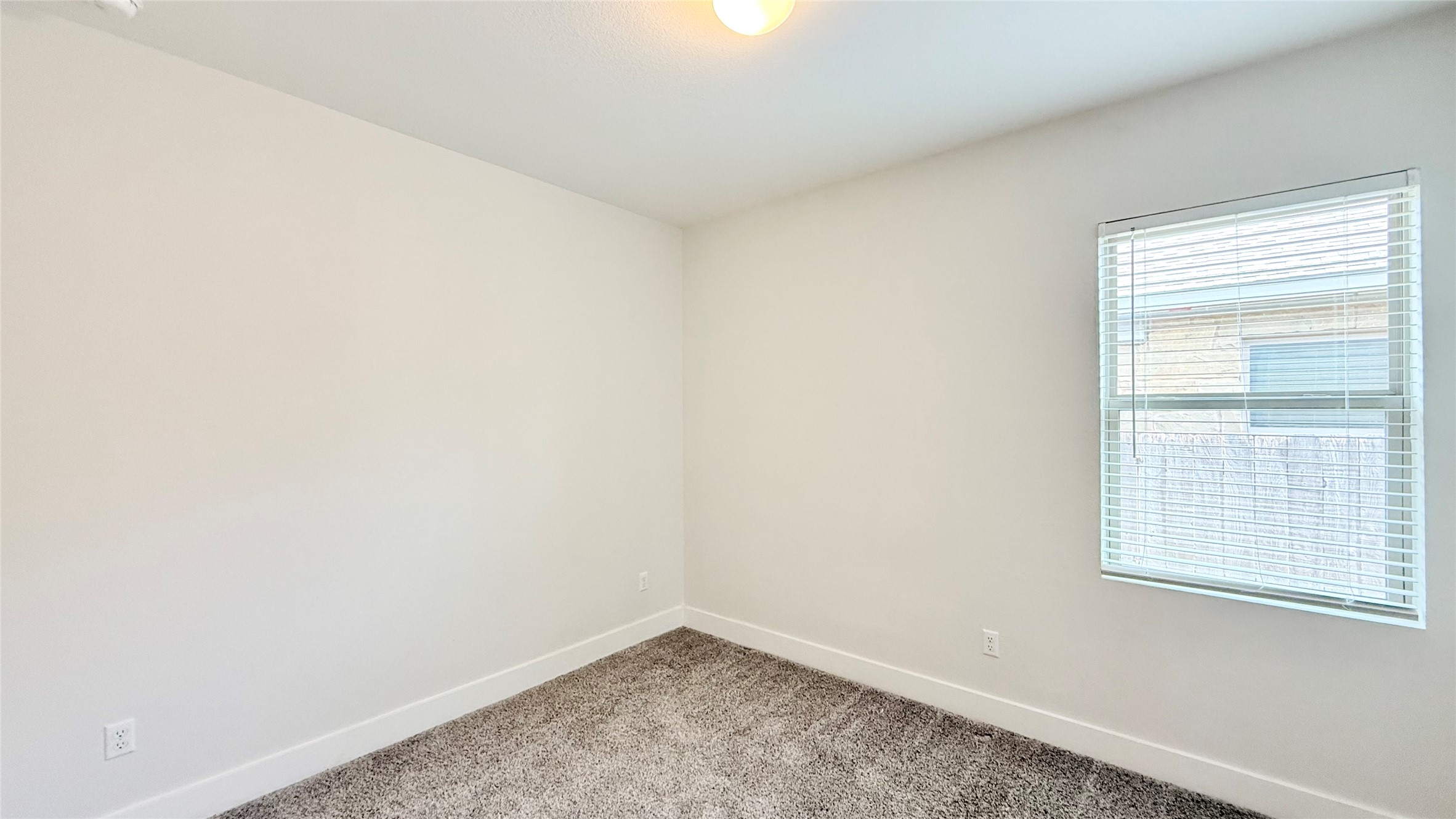 600 Golden Glory Road Leander, TX 78641 - Photo 7 of 21 Unfurnished room with baseboards and light carpet