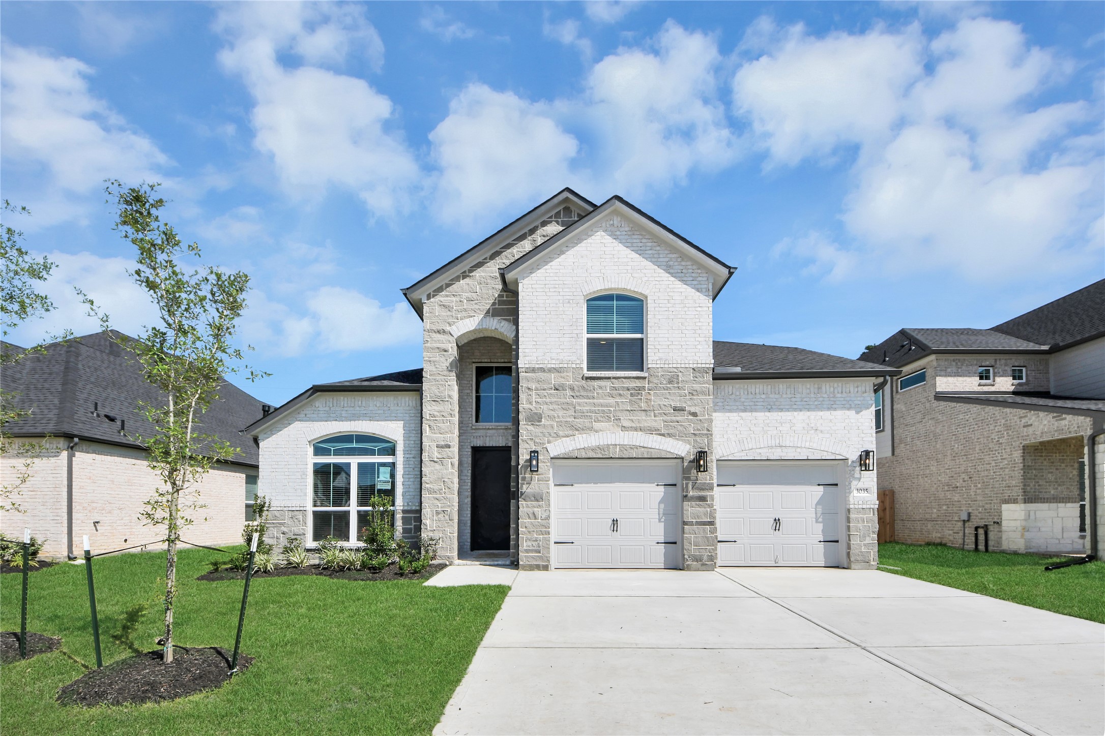 3035 Native Spg Drive Spring, TX 77373 - Photo 2 of 43 The residence features a practical 2-car garage complemented by a generous driveway, ensuring abundant space for parking needs.